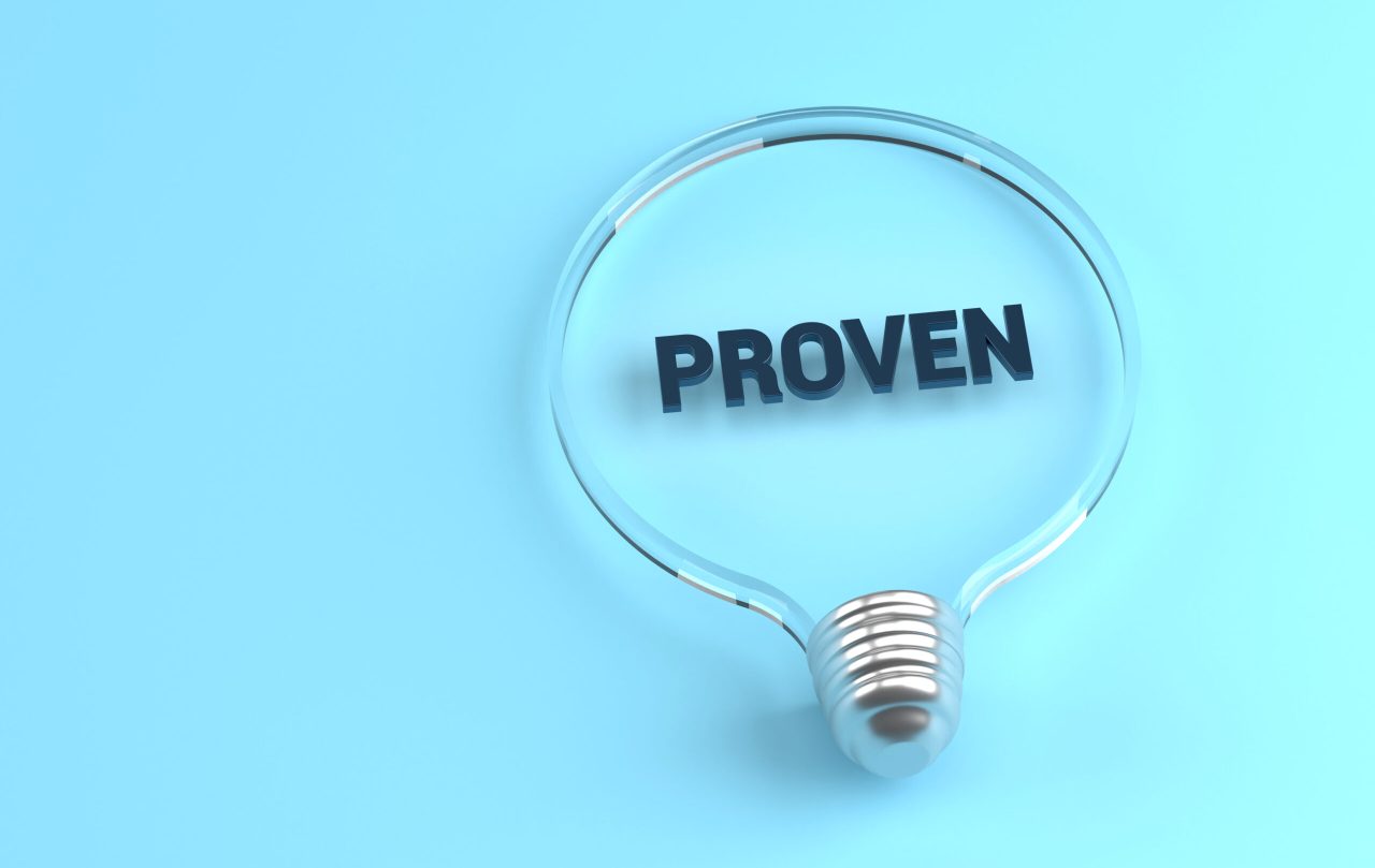 Transparent light bulb on blue background and Proven message inside. Idea and Solution Concept.